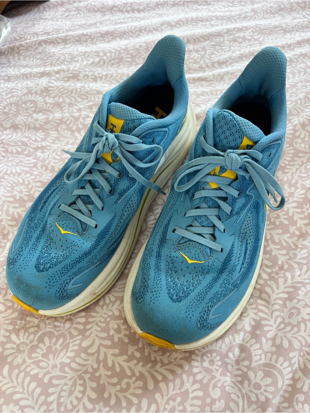 Hoka One One Light Blue Running Shoe with Yellow Accent